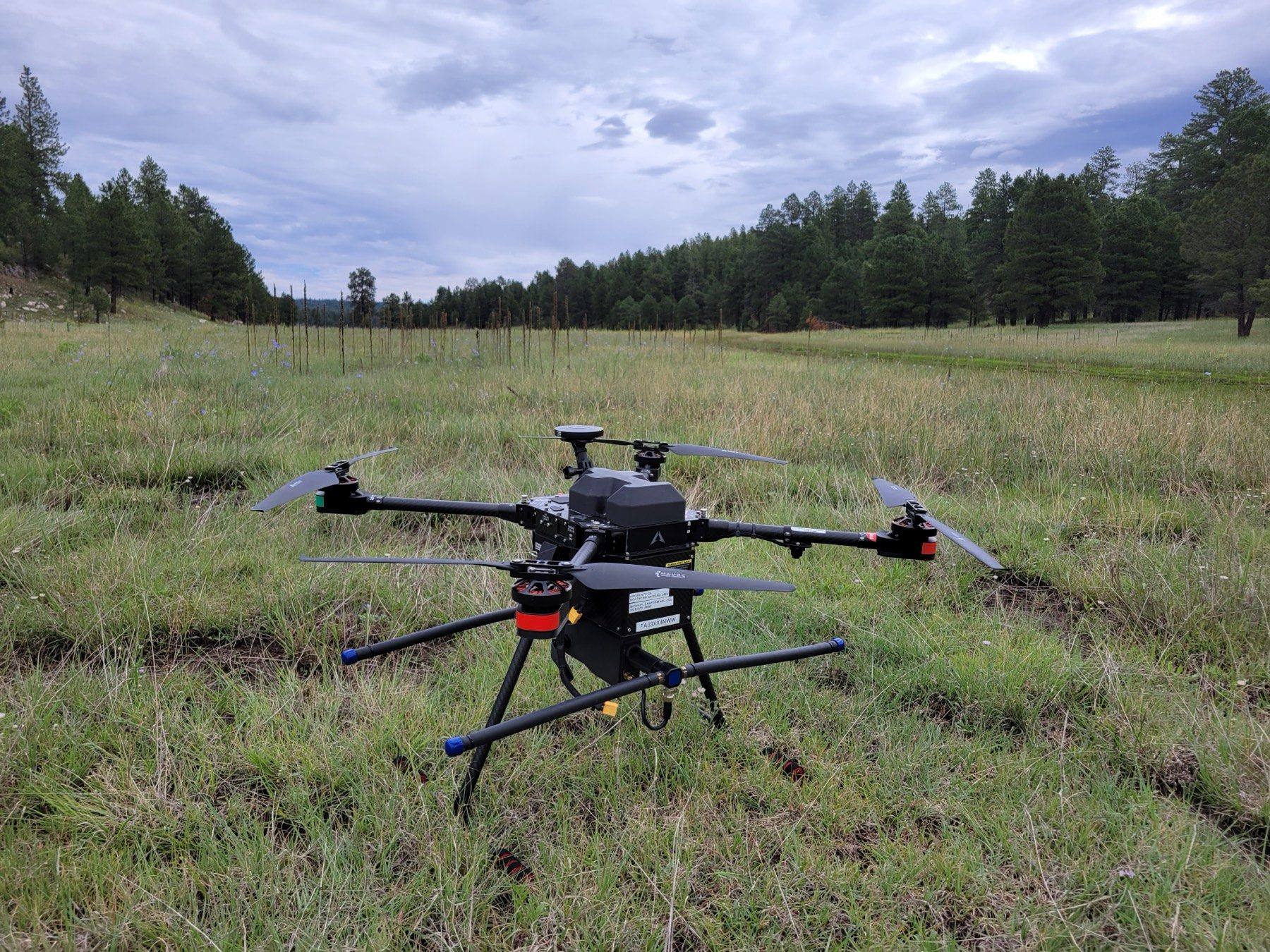 The lab's UAV-RT drone on the ground in a mountain meadow near Mormon Lake, Arizona
